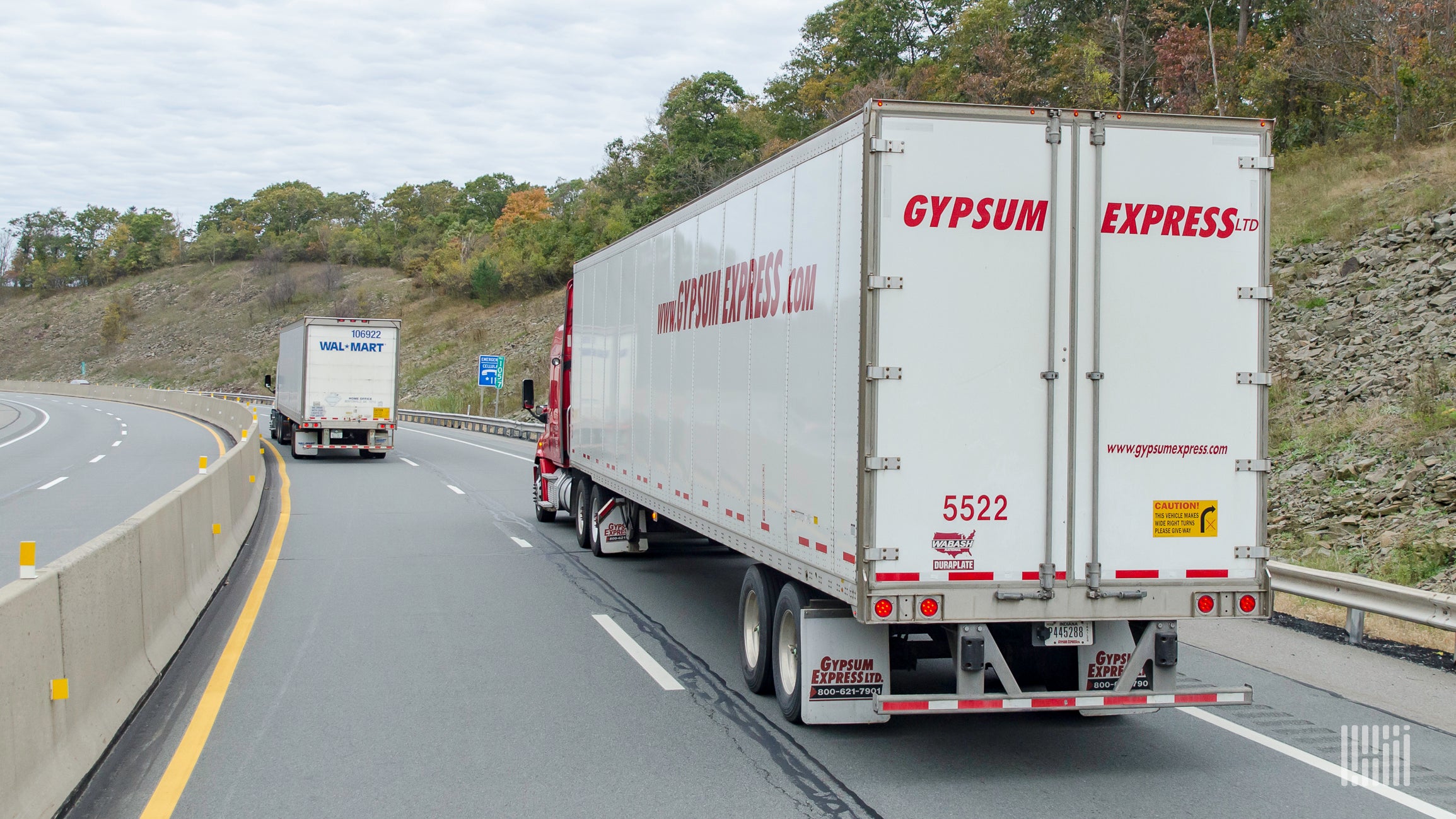 Rear view of a Gypsum Express tractor trailer on the highway.