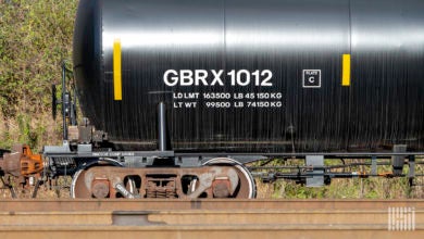 A tank car is parked on railroad track.