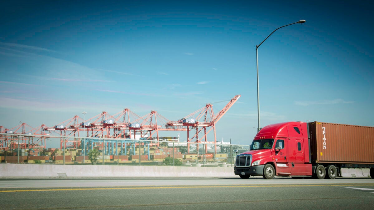 truck moving container at port