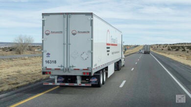 A rear view of a Forward Air trailer on the highway