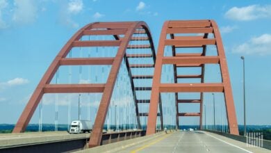 Volvo truck crosses the I-255/U.S. 50 span the Mississippi River Jefferson Barracks Memorial Arch Bridge